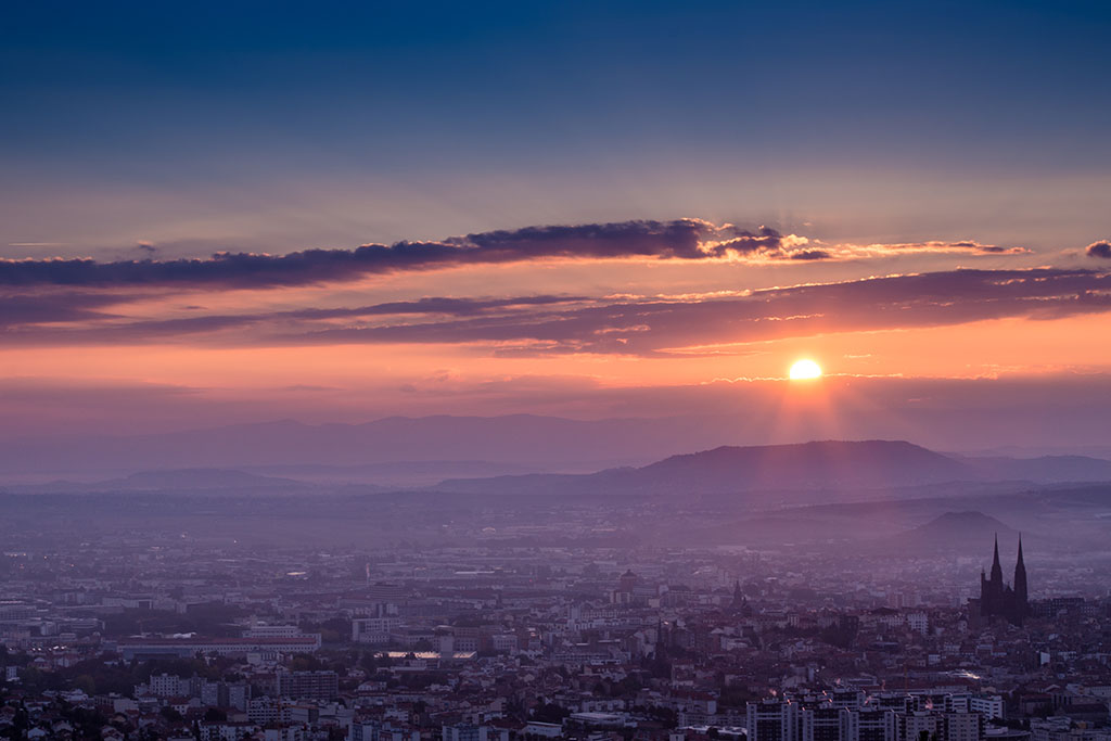 Orange sunrise in Clermont-Ferrand, France.
